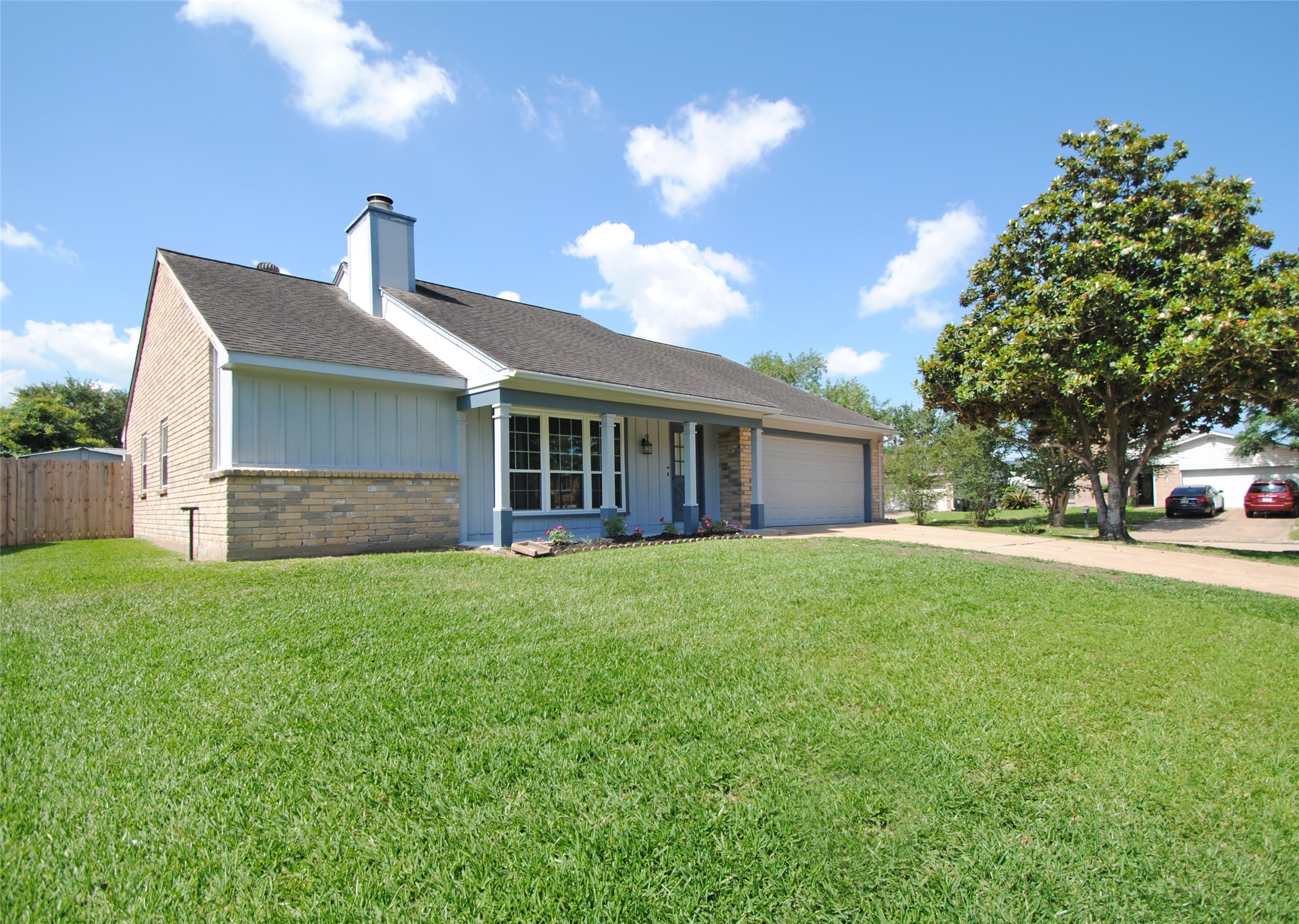 22831 John Rolfe Lane Katy, TX 77449 - Photo 3 of 34 a front view of a house with a yard and garage