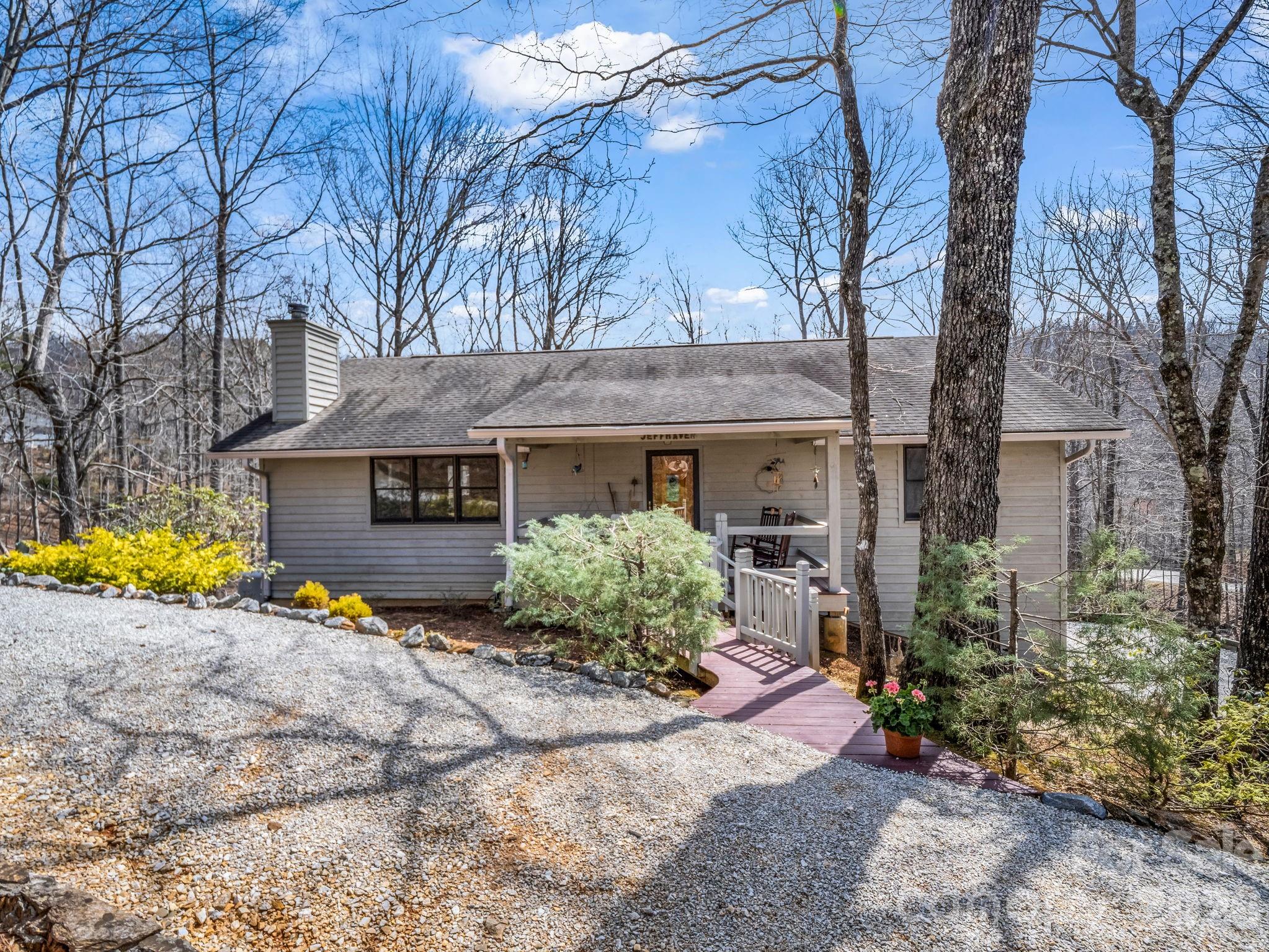 780 Rixhaven Drive Saluda, NC 28773 - Photo 2 of 36 a view of a house with a yard covered in snow
