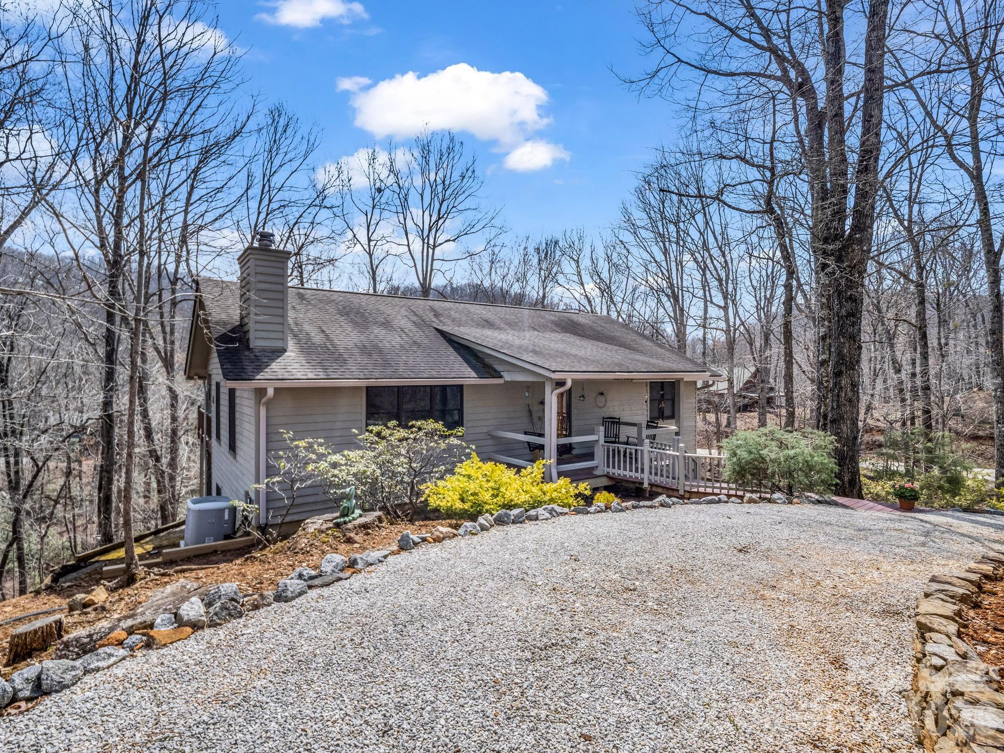 780 Rixhaven Drive Saluda, NC 28773 - Photo 3 of 36 a view of a house with a yard covered with snow in the yard