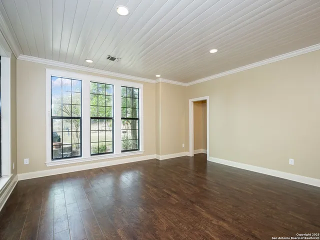 a kitchen with granite countertop a stove and a refrigerator