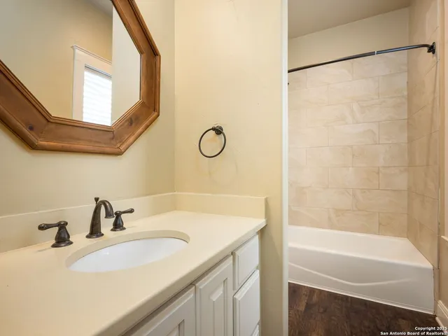 a view of an entryway with wooden floor and windows