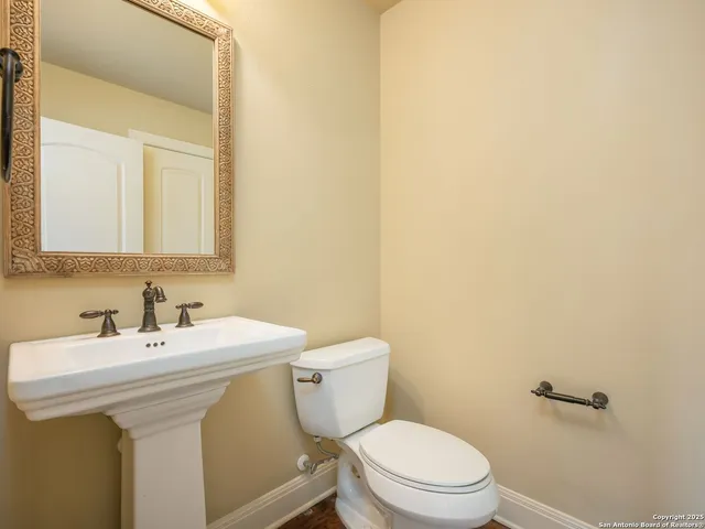 a large spacious bathroom with a granite countertop tub a mirror and a shower