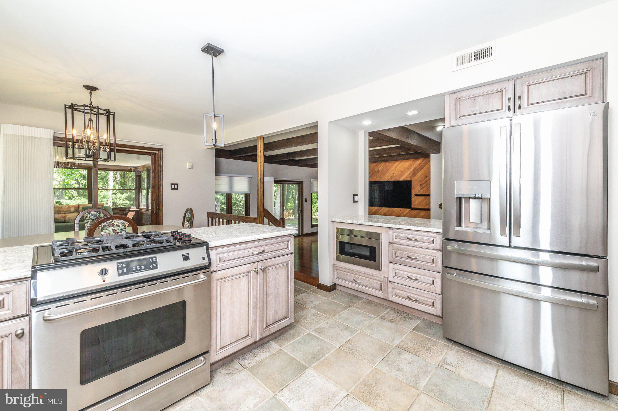 434 4th Street Atco, NJ 08004 - Photo 15 of 69 a kitchen with stainless steel appliances white cabinets and a stove top oven