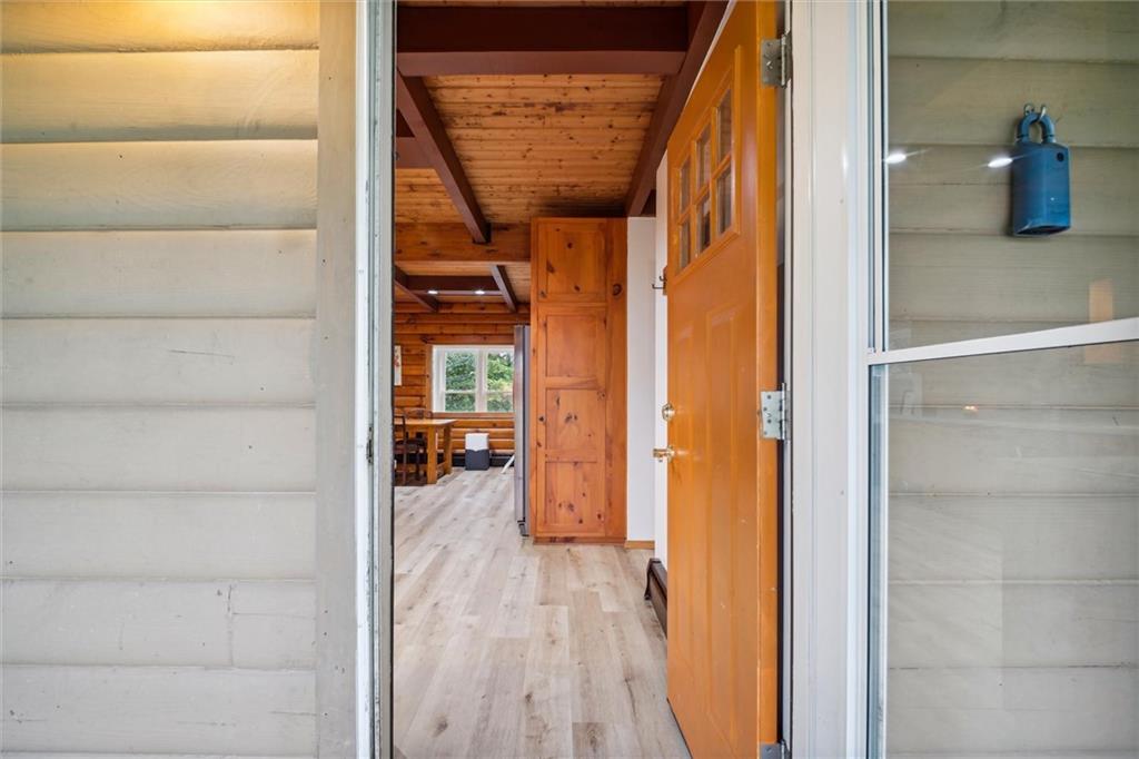 167 Wilkinson Road Templeton, PA 16259 - Photo 5 of 49 a view of a hallway with wooden shelves and entryway