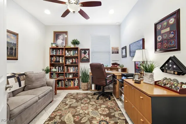 a living room with furniture workspace and a window