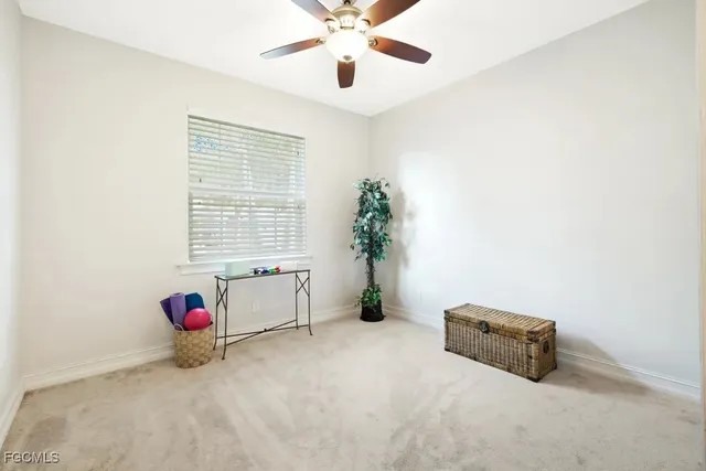 a living room with furniture and white walls