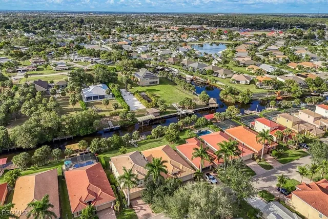 an aerial view of residential houses with outdoor space