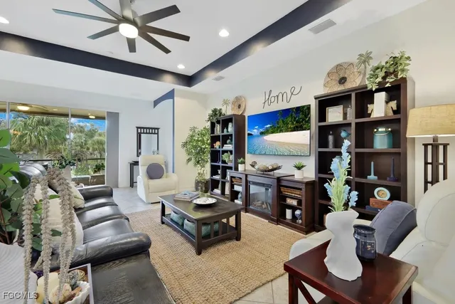 a living room with furniture fireplace and flat screen tv
