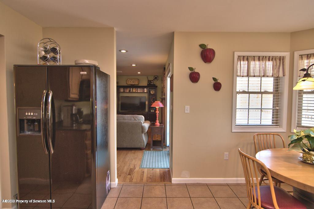 521 Summit Woods Road Moscow, PA 18444 - Photo 24 of 77 a kitchen with stainless steel appliances granite countertop a refrigerator and a sink