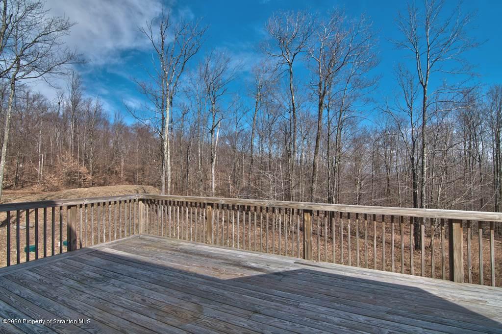 521 Summit Woods Road Moscow, PA 18444 - Photo 61 of 77 a view of deck with wooden floor and fence