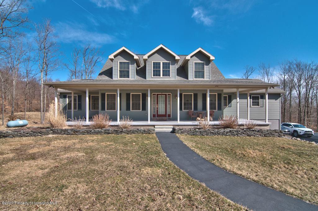 521 Summit Woods Road Moscow, PA 18444 - Photo 64 of 77 front view of a house with a yard