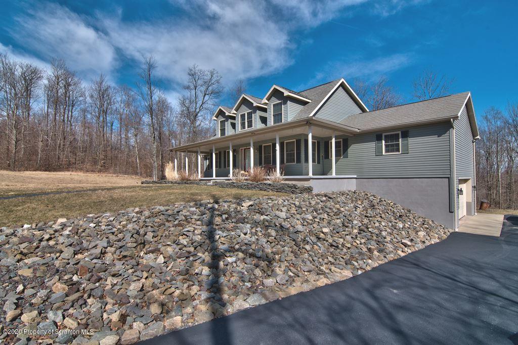 521 Summit Woods Road Moscow, PA 18444 - Photo 67 of 77 front view of a house with a yard