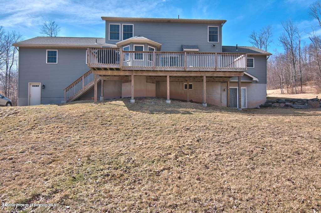 521 Summit Woods Road Moscow, PA 18444 - Photo 70 of 77 a front view of house with yard
