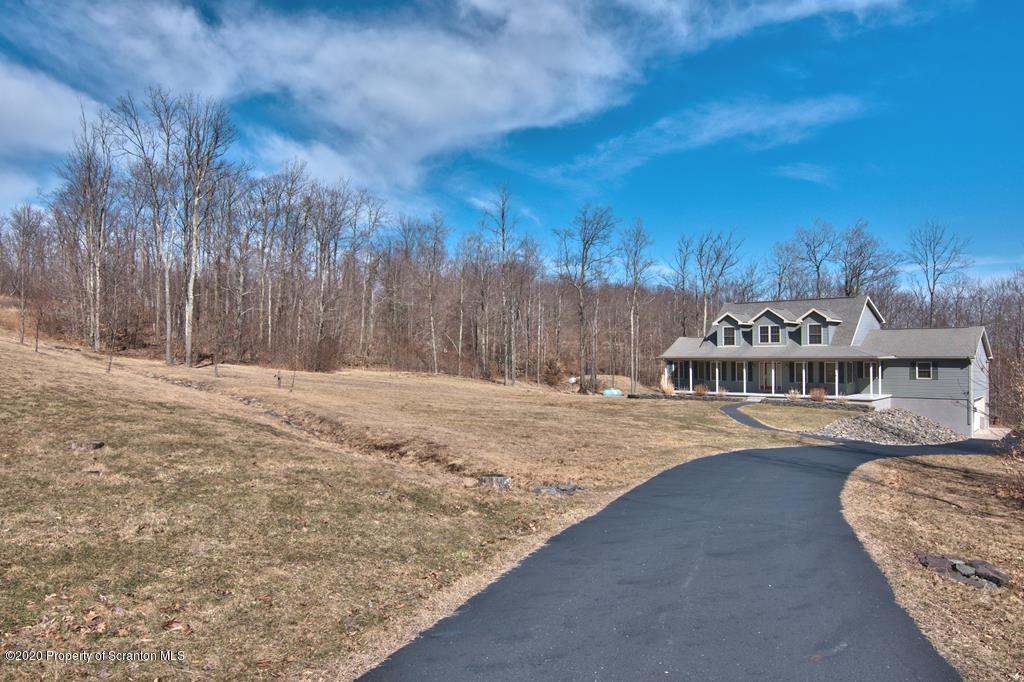 521 Summit Woods Road Moscow, PA 18444 - Photo 76 of 77 a view of swimming pool with a yard in front of it