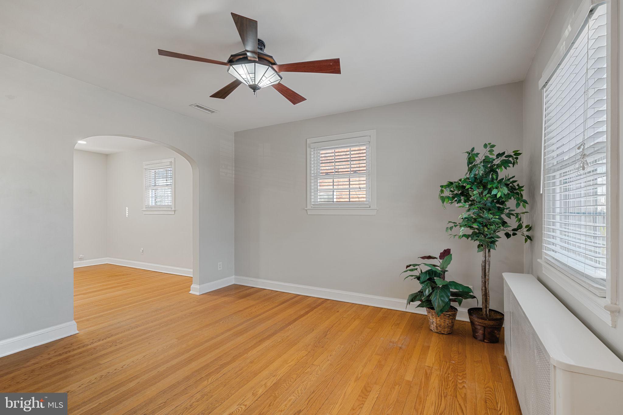 204 South Courthouse Road Arlington, VA 22204 - Photo 12 of 49 a view of empty room with wooden floor and potted plant