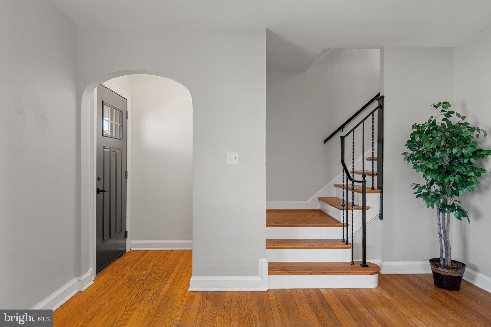 204 South Courthouse Road Arlington, VA 22204 - Photo 13 of 49 a view of entryway with wooden floor and stairs