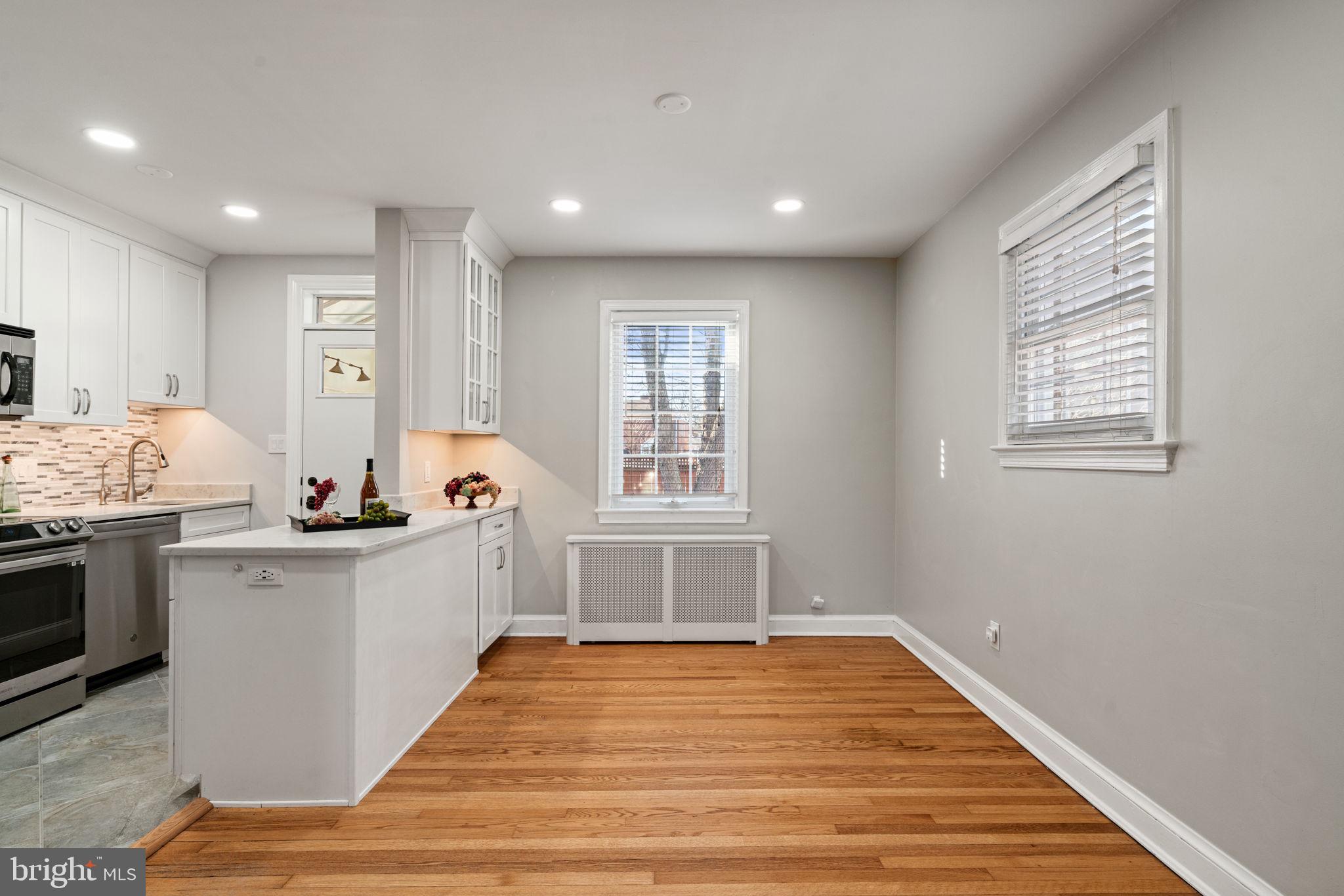 204 South Courthouse Road Arlington, VA 22204 - Photo 14 of 49 a kitchen with sink a stove and cabinets