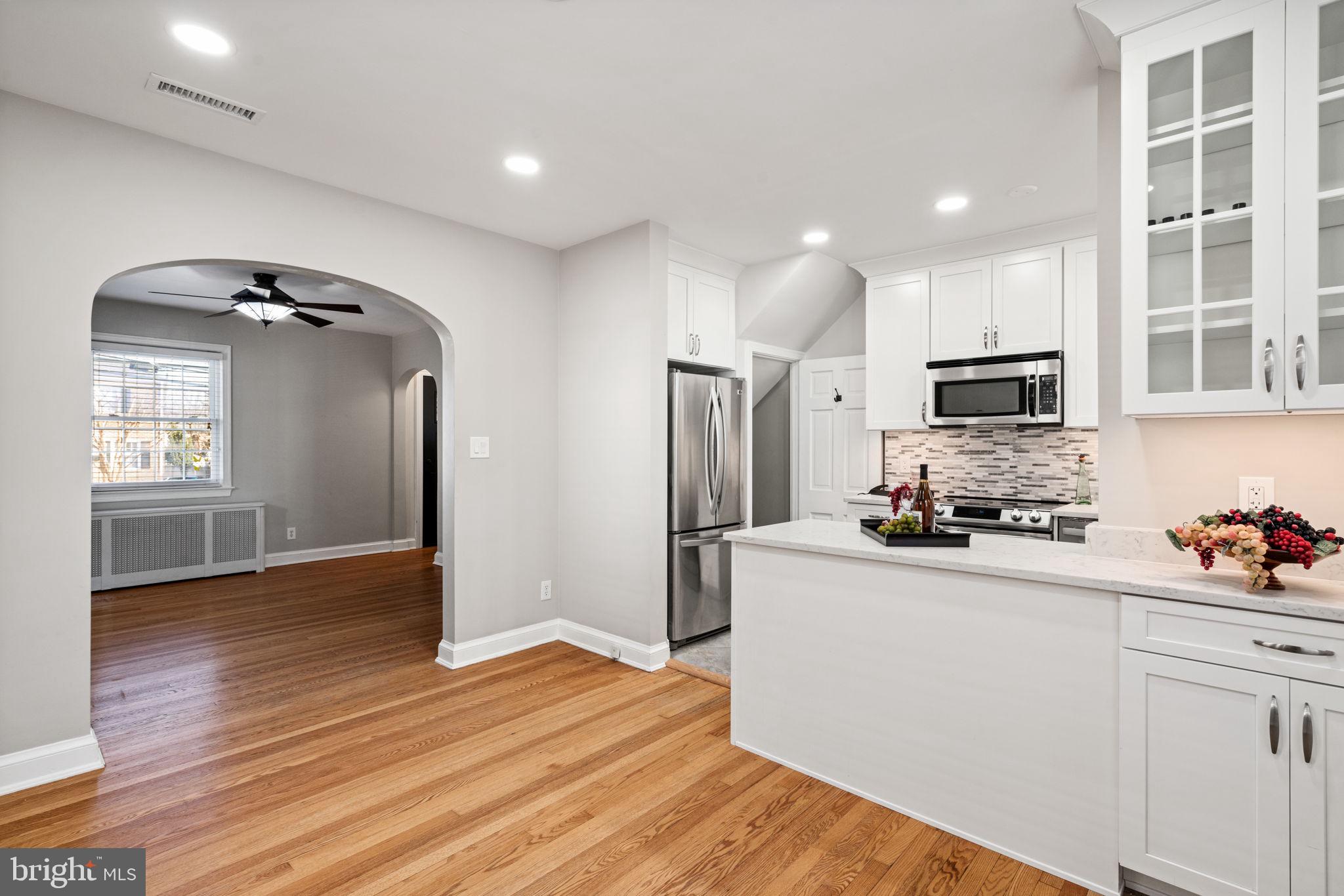 204 South Courthouse Road Arlington, VA 22204 - Photo 16 of 49 a kitchen with stainless steel appliances a refrigerator stove microwave and sink