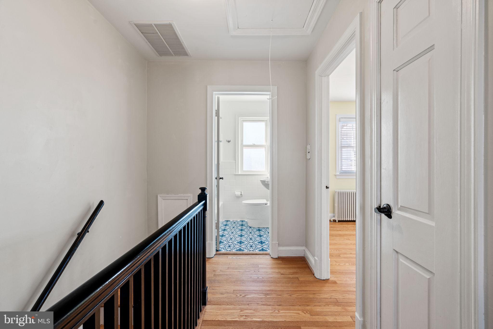 204 South Courthouse Road Arlington, VA 22204 - Photo 22 of 49 a view of a hallway view with wooden floor and staircase