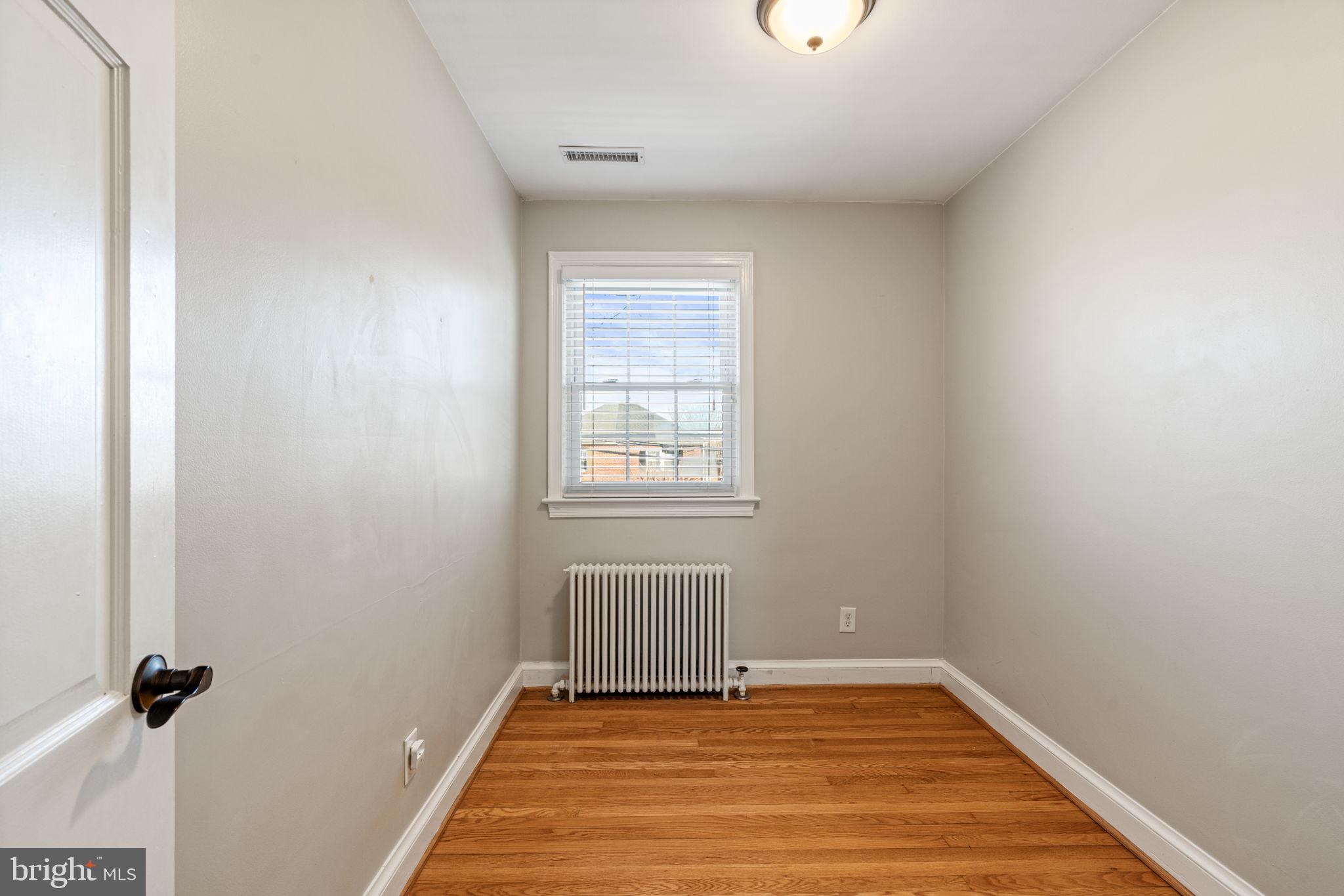 204 South Courthouse Road Arlington, VA 22204 - Photo 25 of 49 a view of an empty room with wooden floor and a window