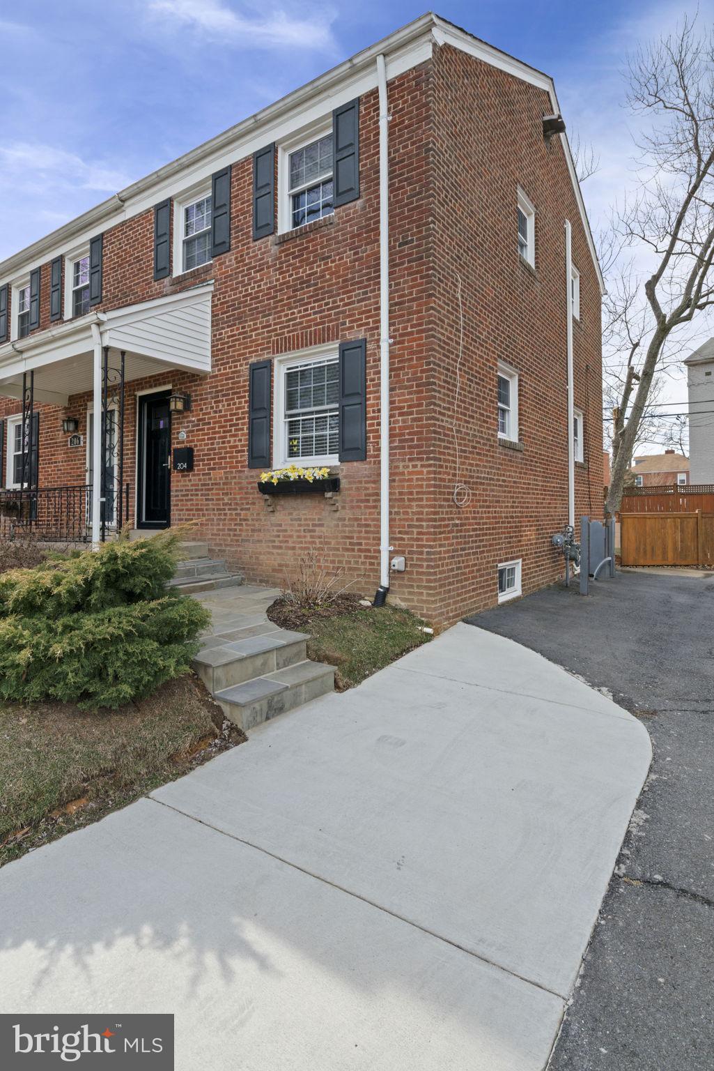 204 South Courthouse Road Arlington, VA 22204 - Photo 40 of 49 a front view of a house with a yard and garage