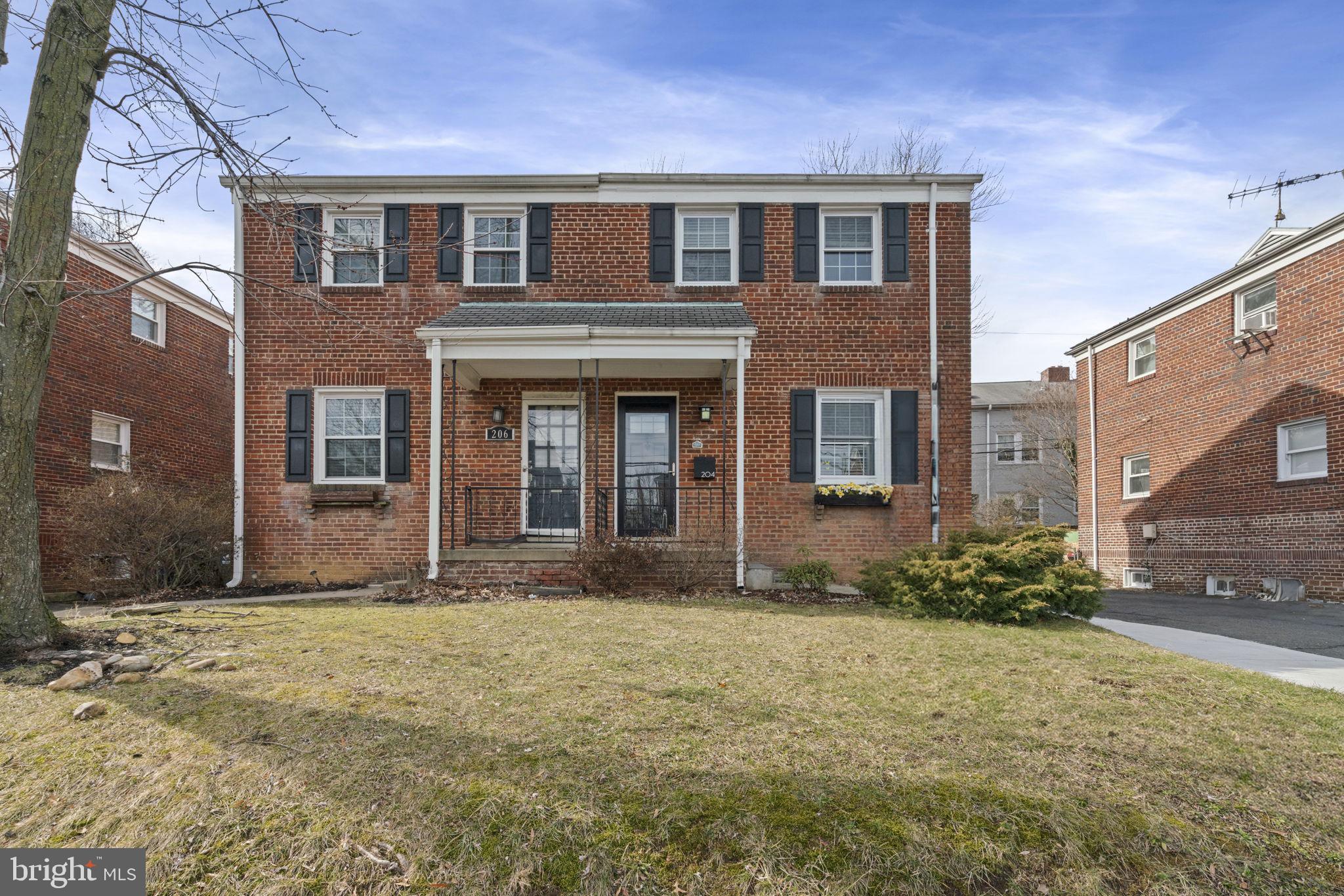 204 South Courthouse Road Arlington, VA 22204 - Photo 44 of 49 a front view of a house with a yard