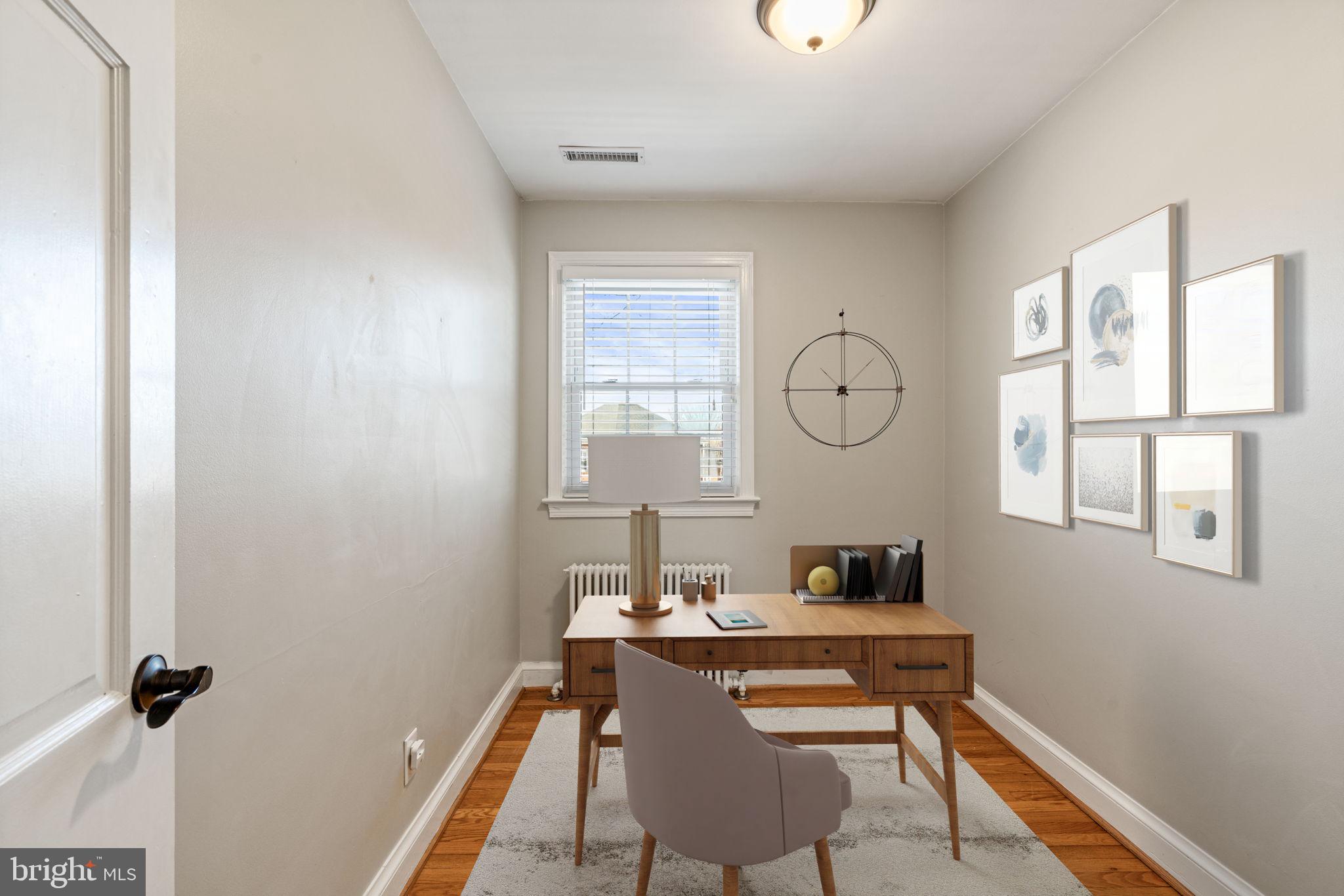204 South Courthouse Road Arlington, VA 22204 - Photo 5 of 49 a workspace with wooden floor and windows