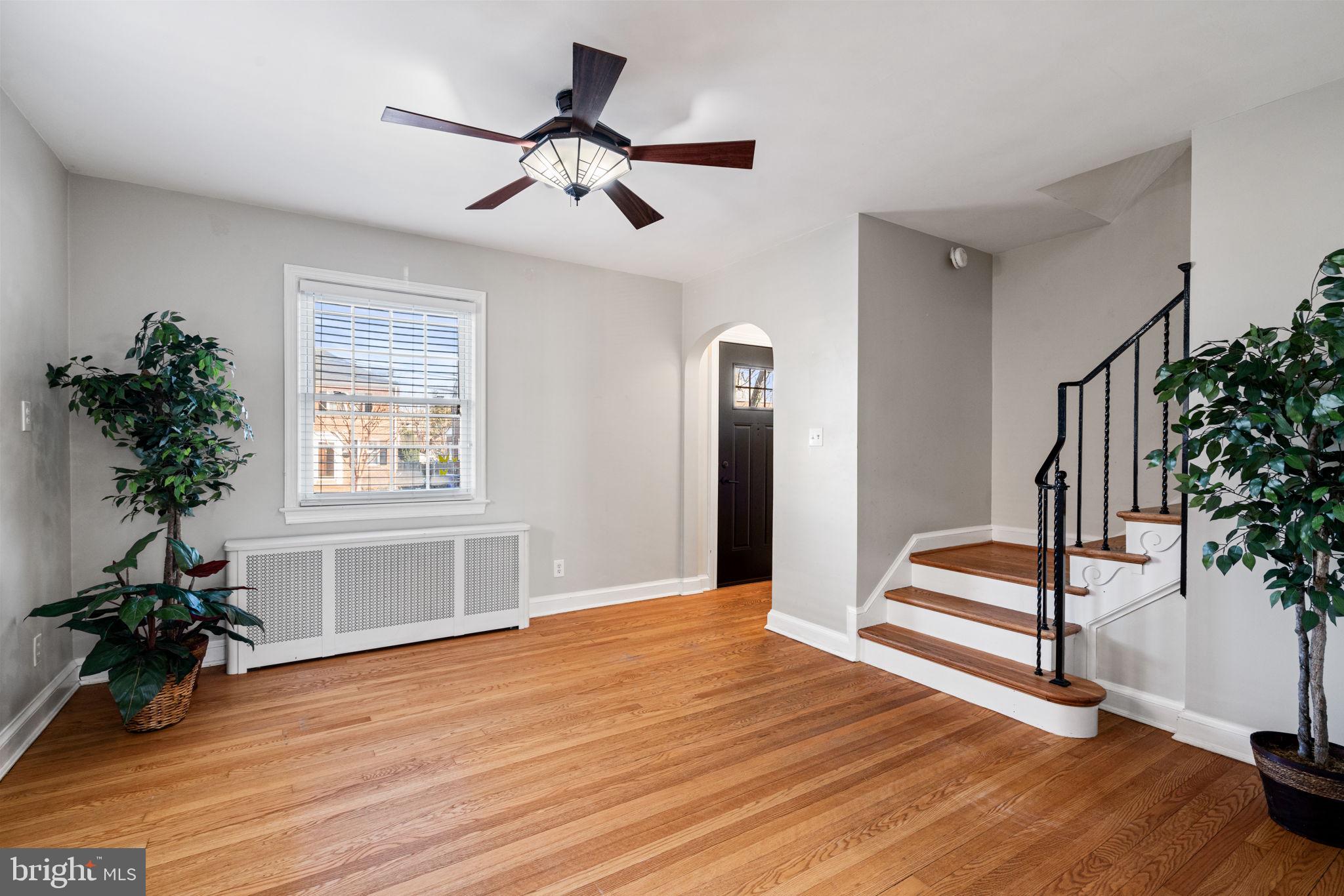 204 South Courthouse Road Arlington, VA 22204 - Photo 9 of 49 a view of an empty room with wooden floor and a window