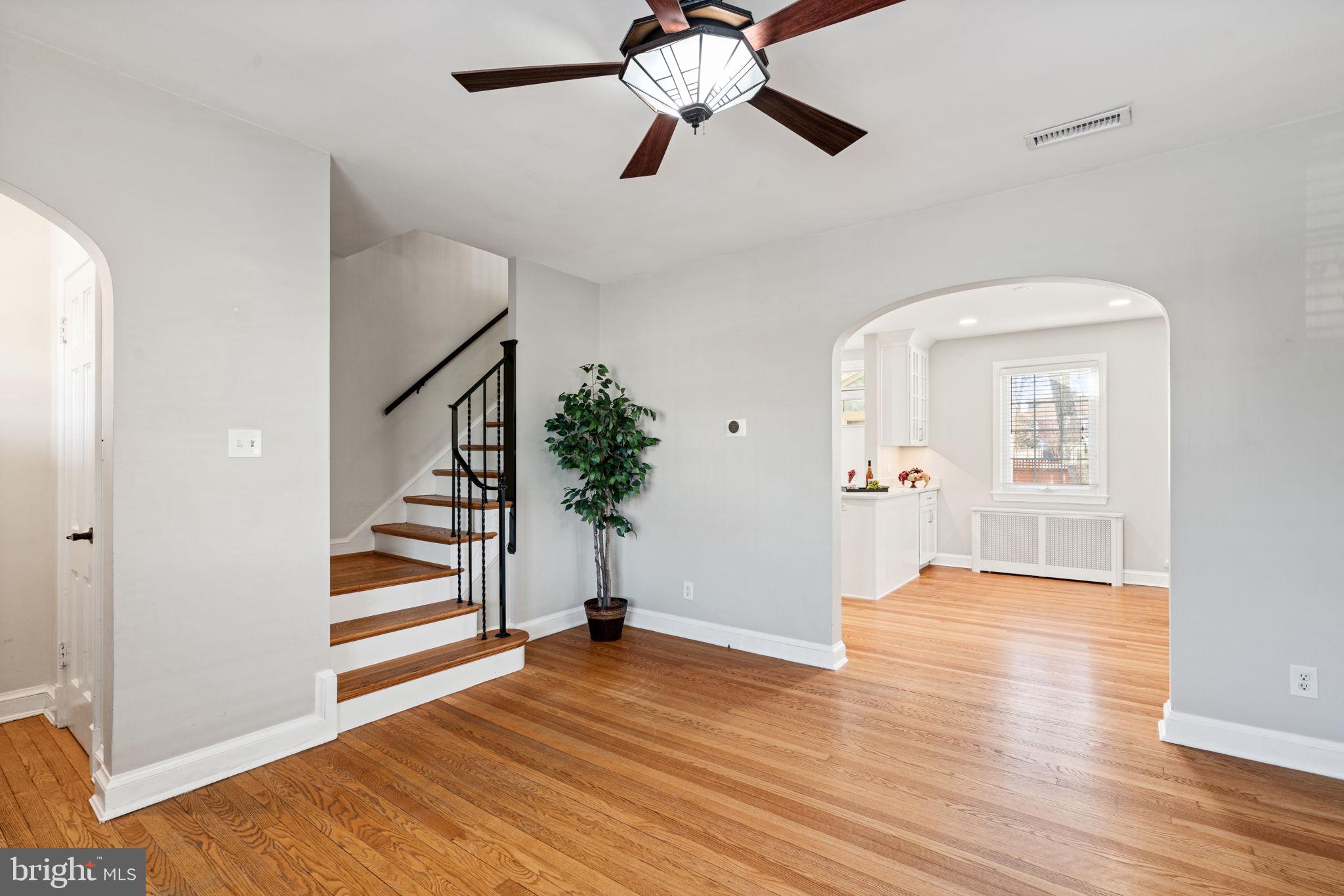 204 South Courthouse Road Arlington, VA 22204 - Photo 10 of 49 a view of an empty room with wooden floor and a ceiling fan