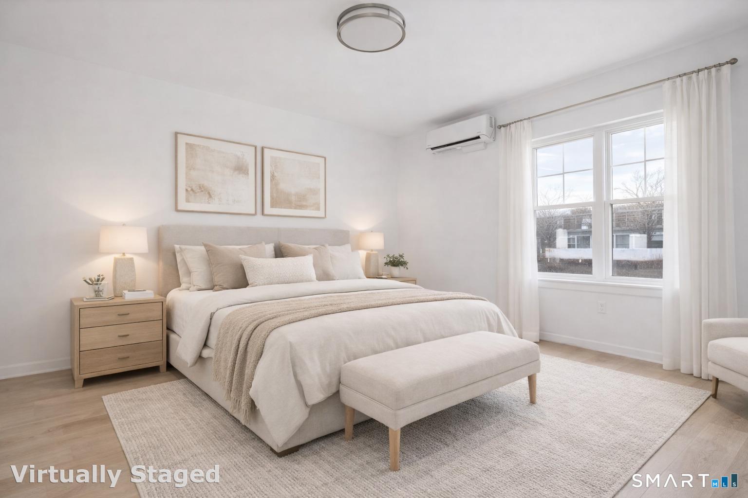 27 Village Road, Unit B Milford, CT 06460 - Photo 2 of 14 a bedroom with a bed and a window