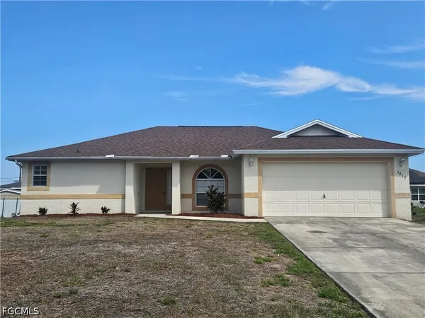 a front view of a house with yard