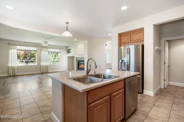 a kitchen with a sink and a refrigerator