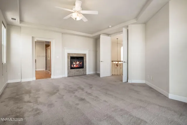 a view of an empty room with a fireplace
