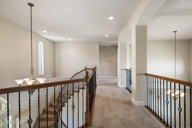 a view of a hallway with stairs