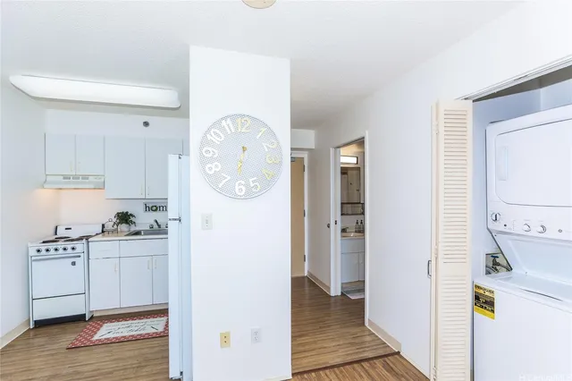a kitchen with a refrigerator and cabinets