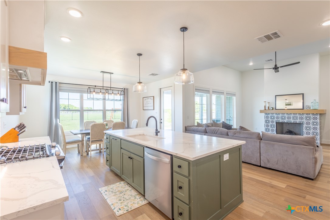 4324 Cedar Creek Road Temple, TX 76504 - Photo 29 of 45 a living room with stainless steel appliances granite countertop furniture and a wooden floor