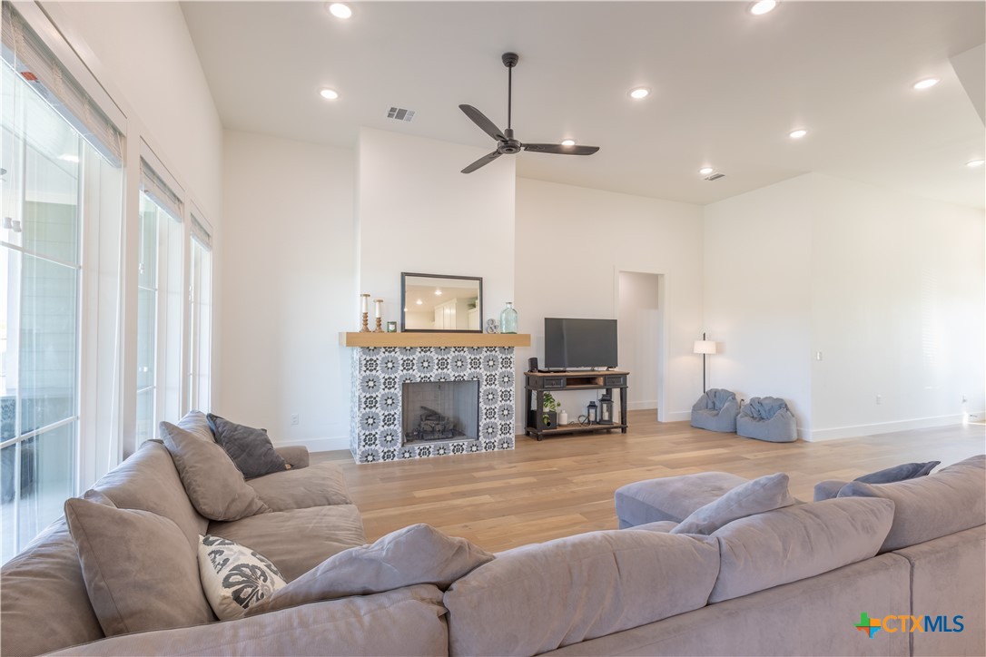 4324 Cedar Creek Road Temple, TX 76504 - Photo 34 of 45 a living room with furniture a fireplace and a flat screen tv