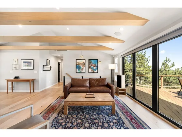 a living room with a flat screen tv and a fireplace