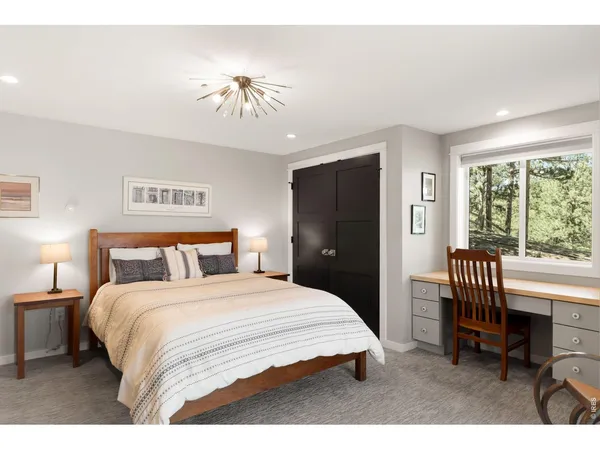 a bedroom with a bed and a chair