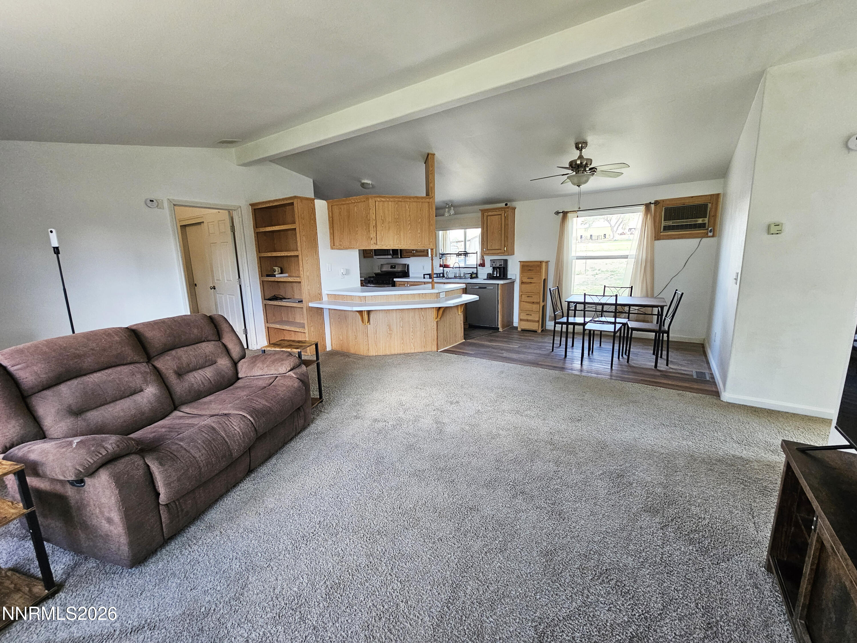 1125 Rancho Road Fernley, NV 89408 - Photo 8 of 47 a living room with furniture and a flat screen tv