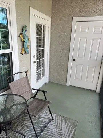 a view of a livingroom with furniture and staircase