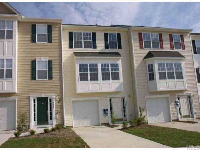 5053 Neuse Commons Lane, Unit 102 Raleigh, NC 27616 - Photo 1 of 1 a front view of a house with a yard