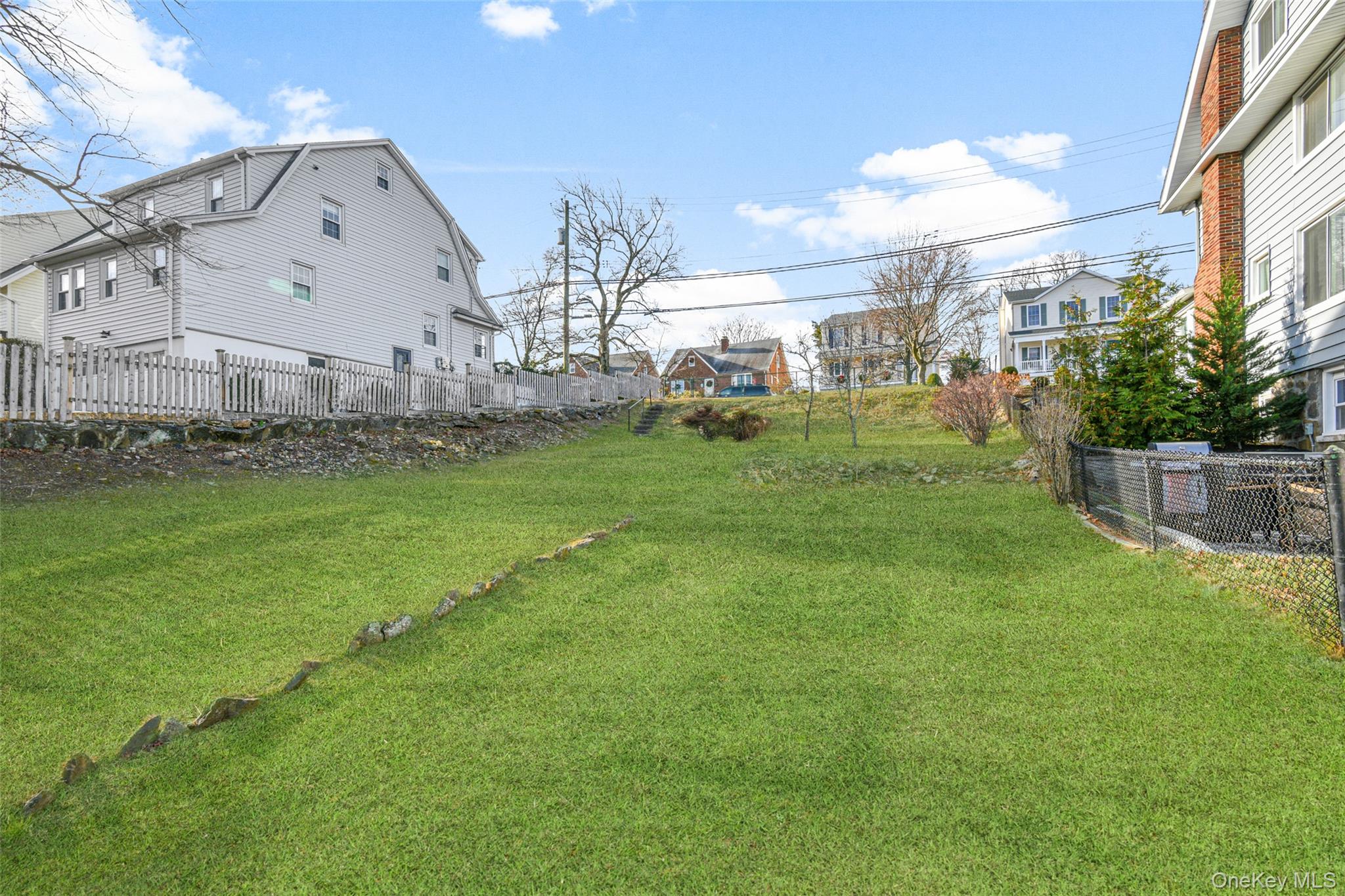 a view of a big room with a big yard and potted plants