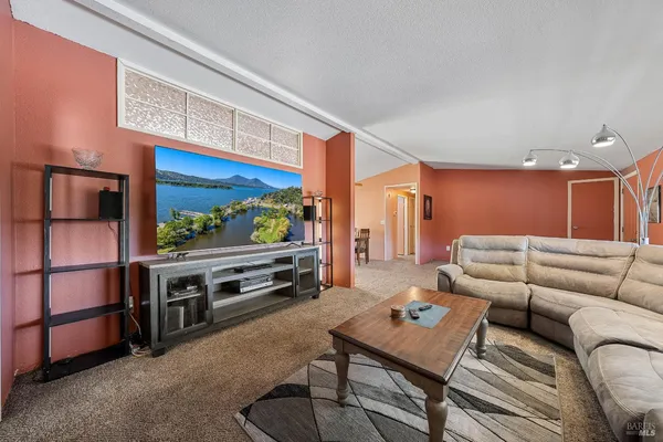 a living room with furniture and a table