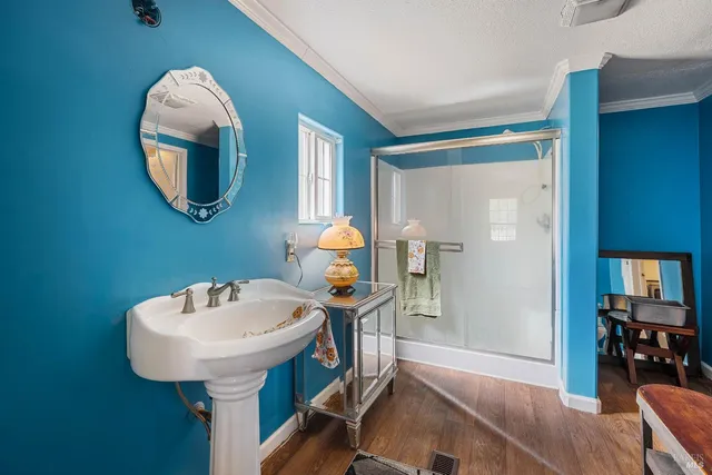 a view of an empty room with window and stairs