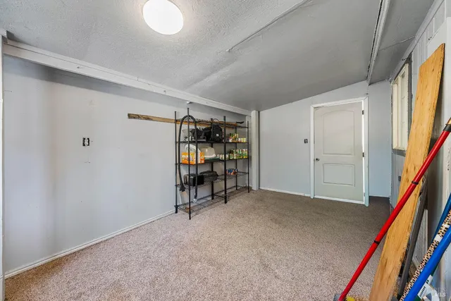 a view of a room with furniture and a window