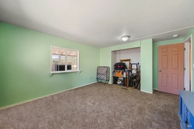 a bedroom with a bed and a walk in closet