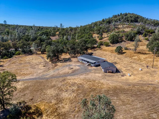 a view of a town with mountains in the background