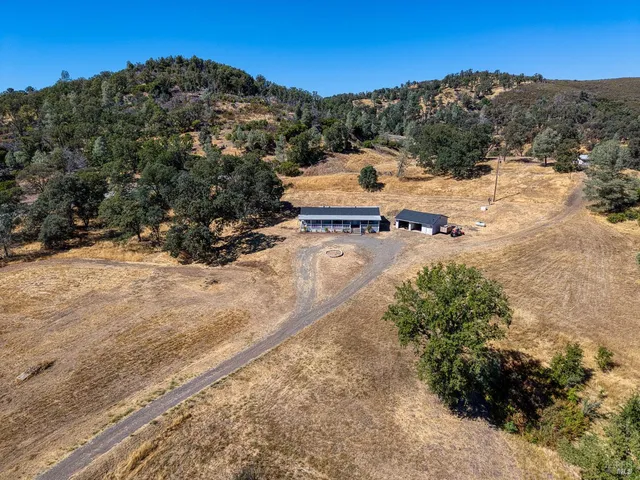 a view of a field with a mountain in the background