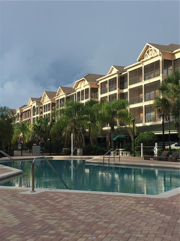 14200 Avalon Road, Unit 204 Winter Garden, FL 34787 - Photo 1 of 1 a front view of a house with a yard